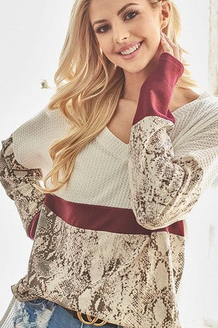 white snake sleeve knit top